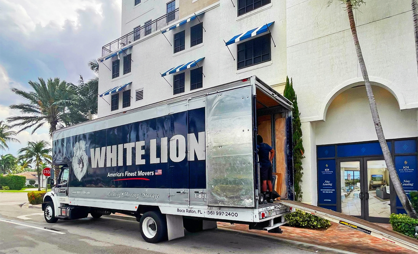 white lion truck outside apartment complex in south florida